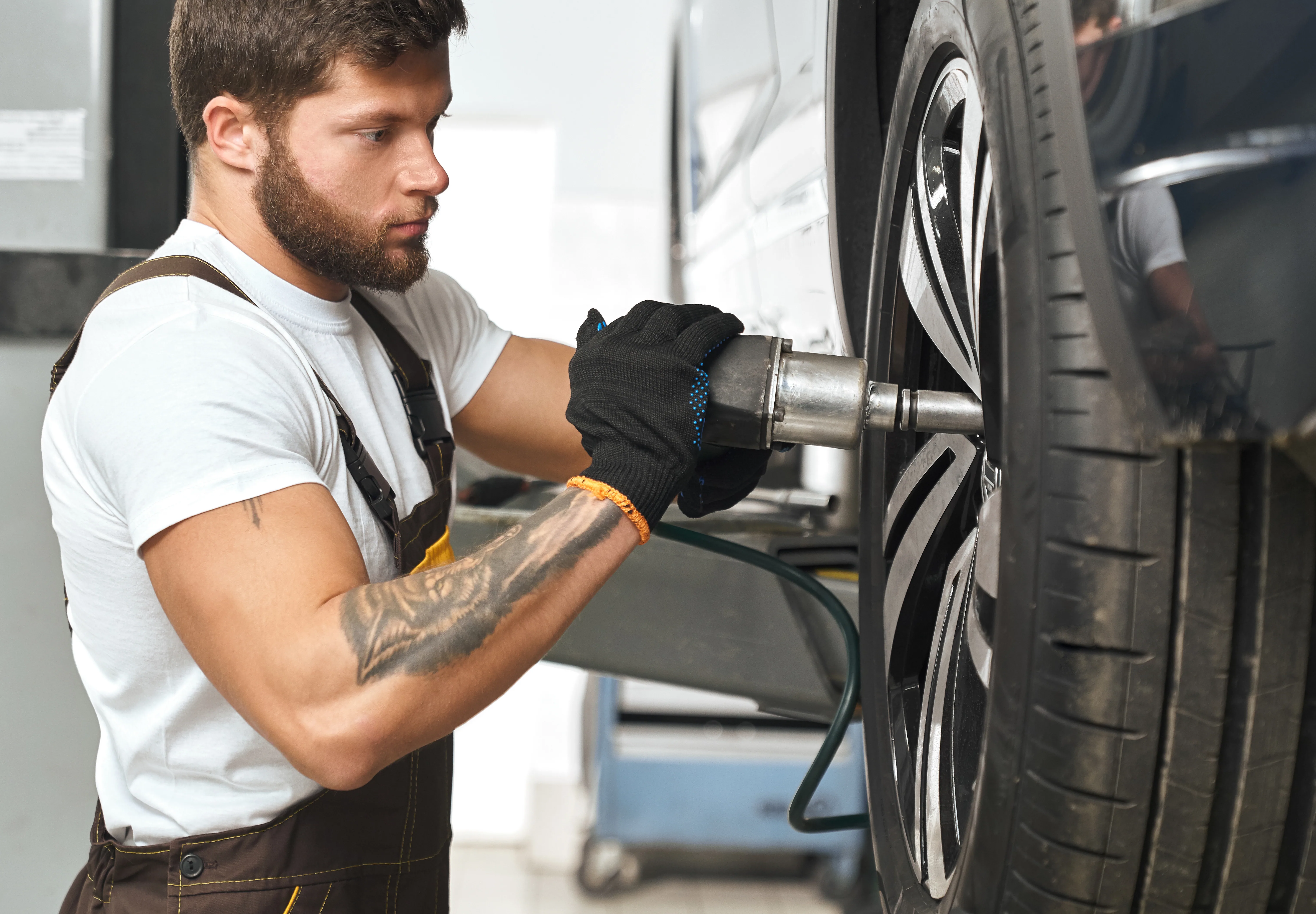 brutal mechanic fixing hubcap car wheel